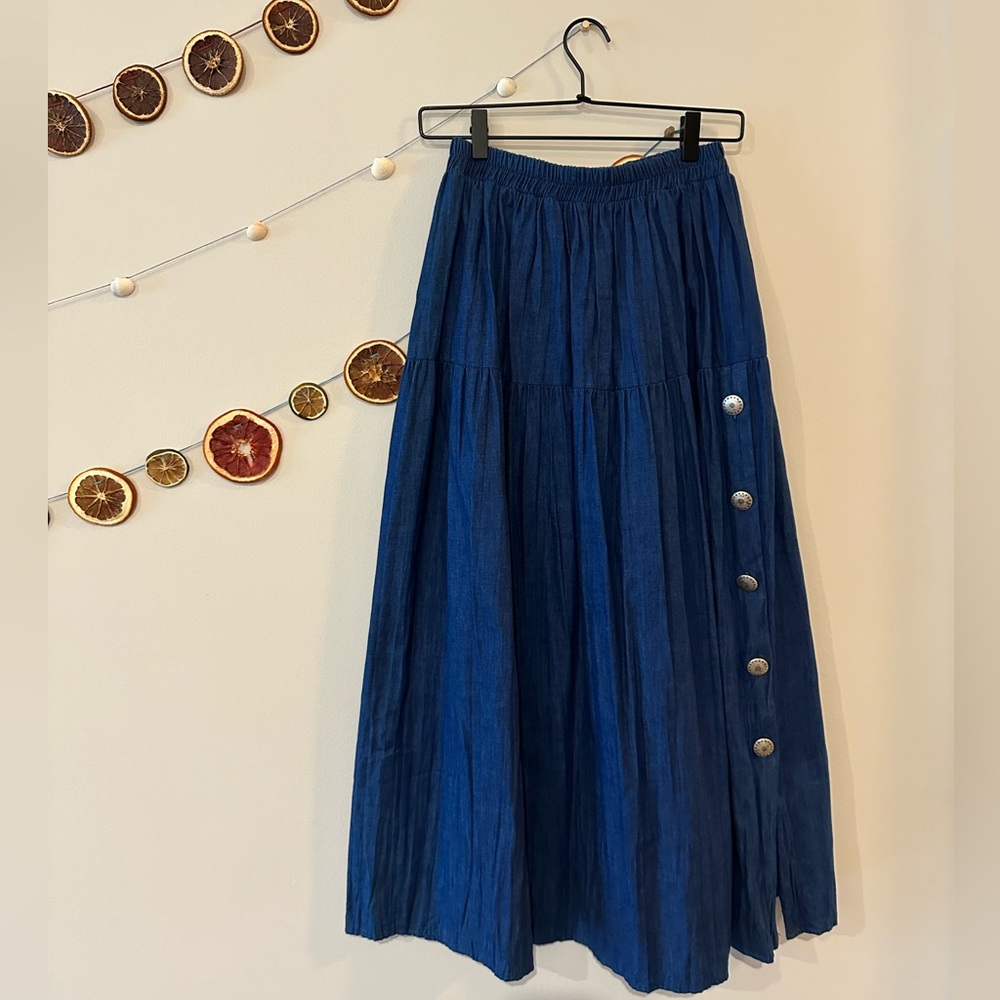 Vintage denim skirt with silver detail buttons. Size M.